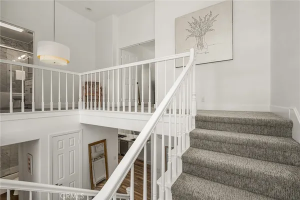 a bathroom with a granite countertop sink a toilet and shower