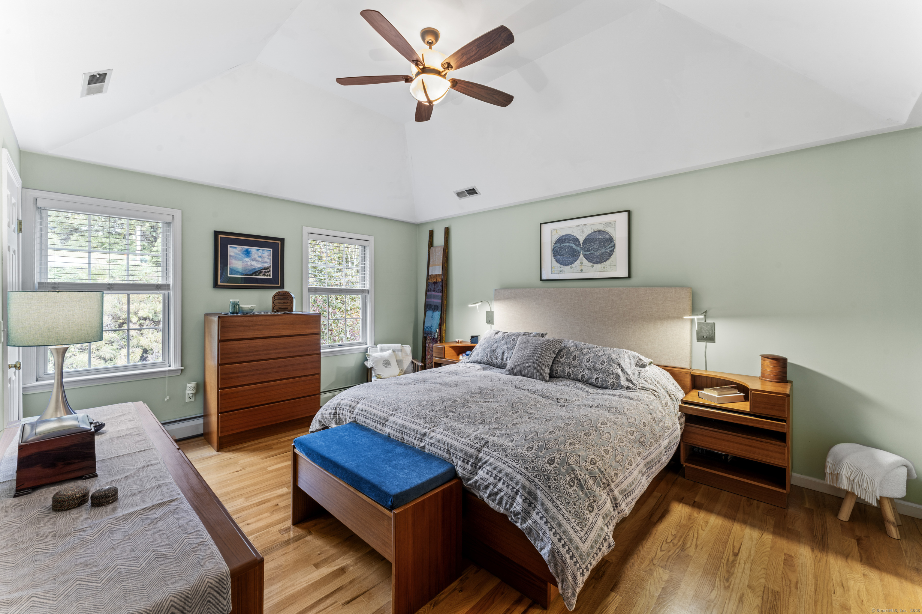 22 Lincoln Road Newtown, CT 06470 - Photo 17 of 36 a bedroom with a bed and a chandelier