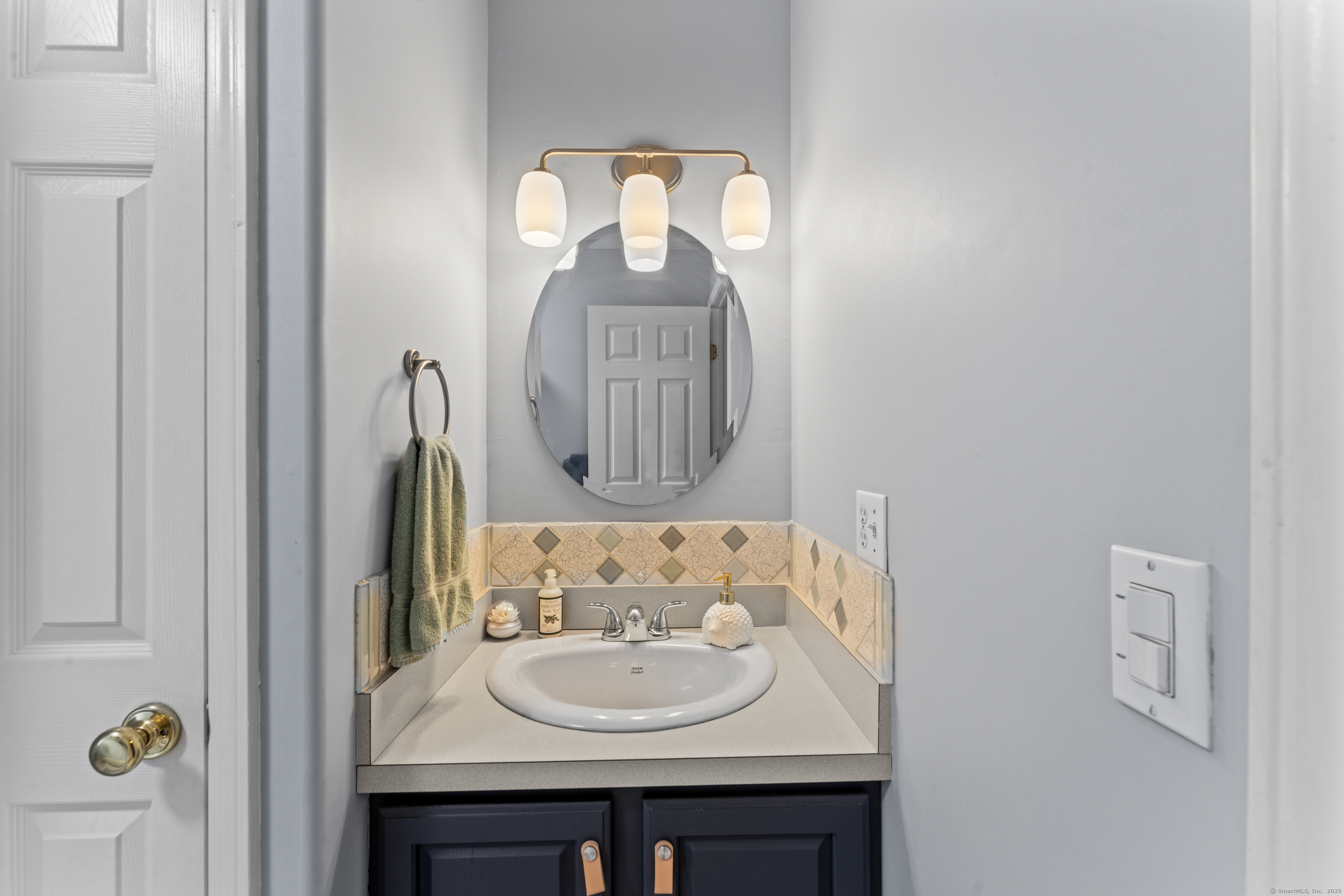 22 Lincoln Road Newtown, CT 06470 - Photo 22 of 36 a bathroom with a sink and a mirror