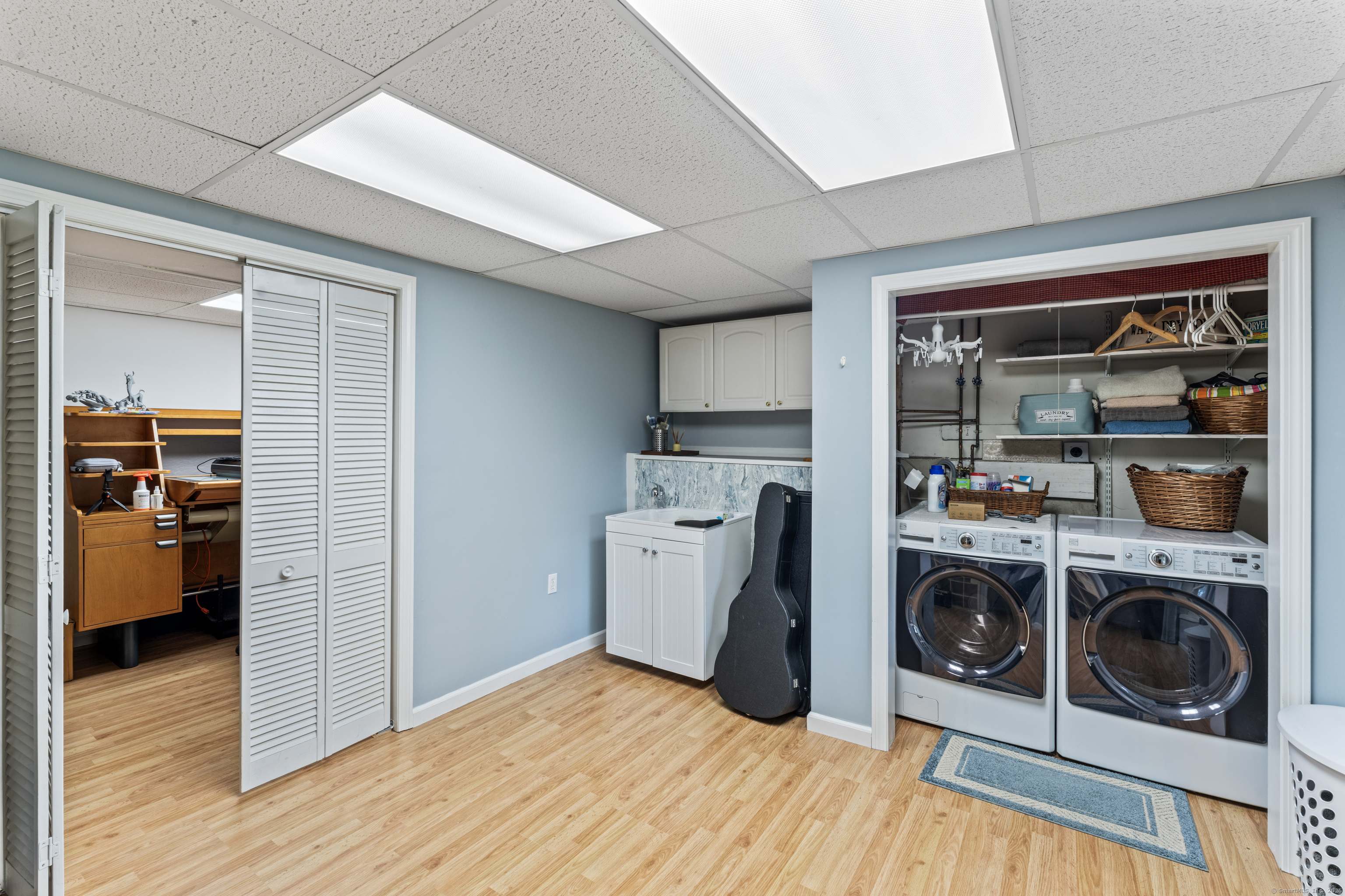 22 Lincoln Road Newtown, CT 06470 - Photo 26 of 36 a view of a storage & utility room with washer and dryer