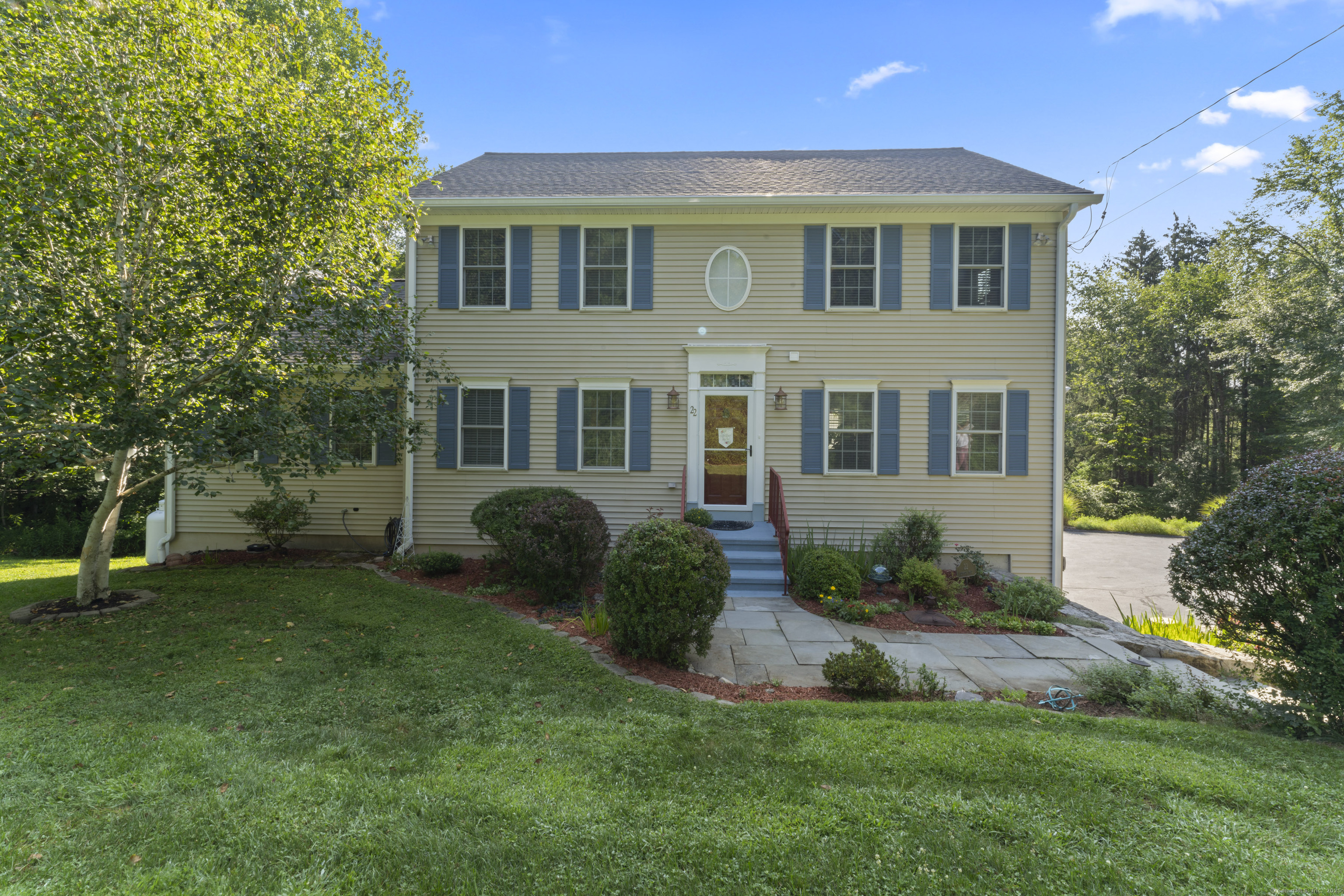 22 Lincoln Road Newtown, CT 06470 - Photo 3 of 36 a front view of a house with a yard and trees