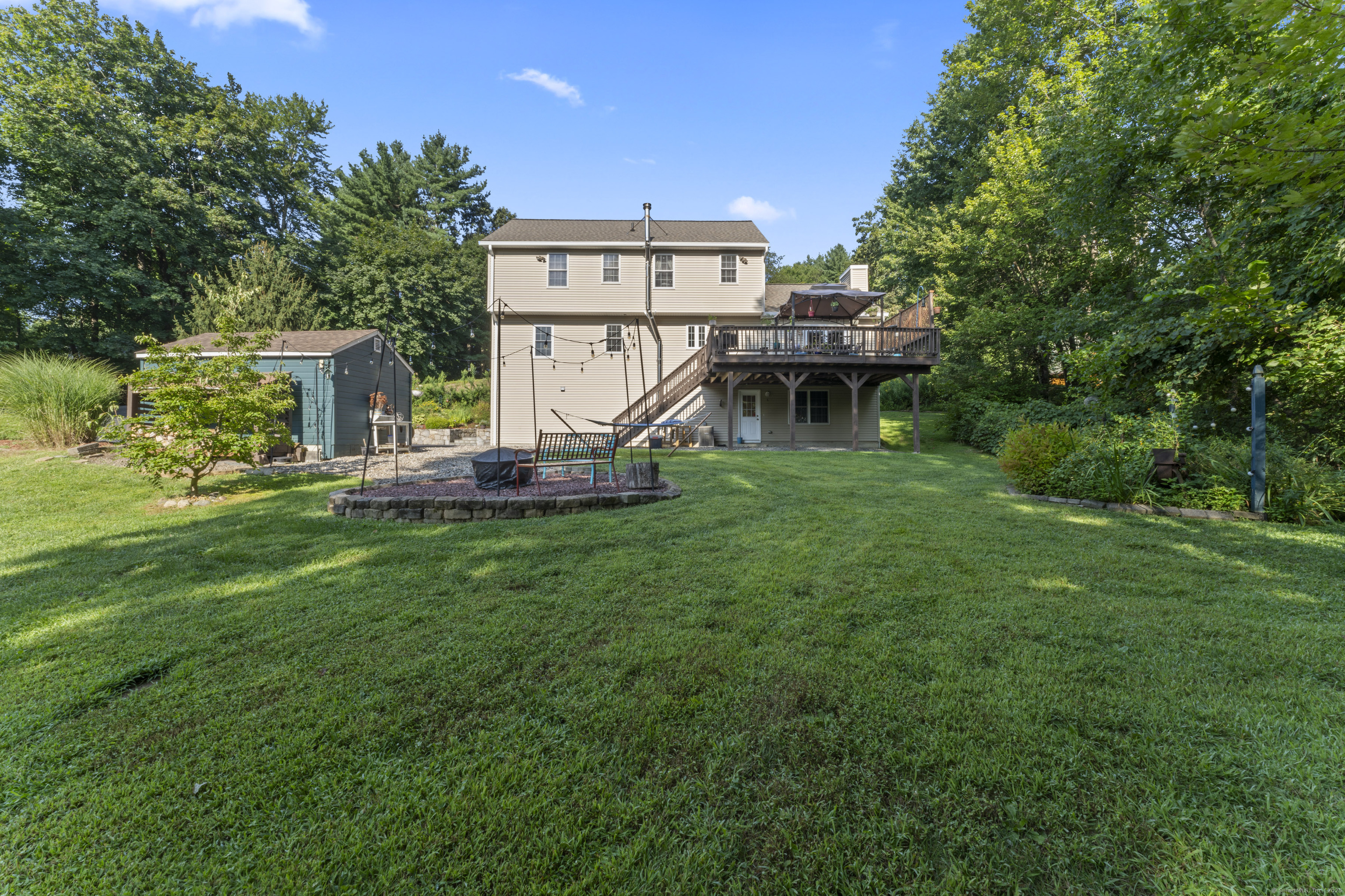 22 Lincoln Road Newtown, CT 06470 - Photo 32 of 36 a view of a house with backyard and sitting area