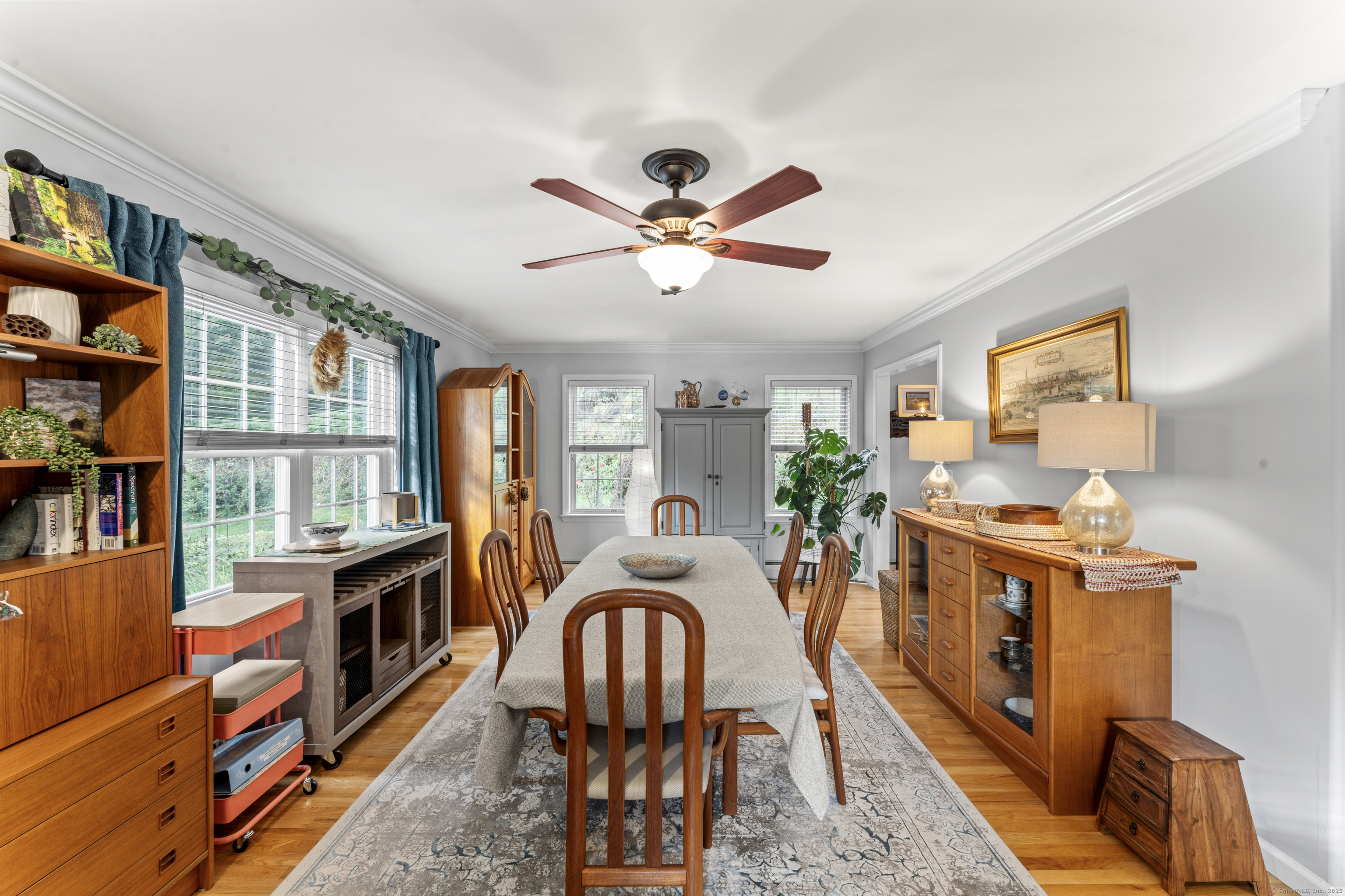 22 Lincoln Road Newtown, CT 06470 - Photo 7 of 36 a dining room with furniture a rug and a chandelier