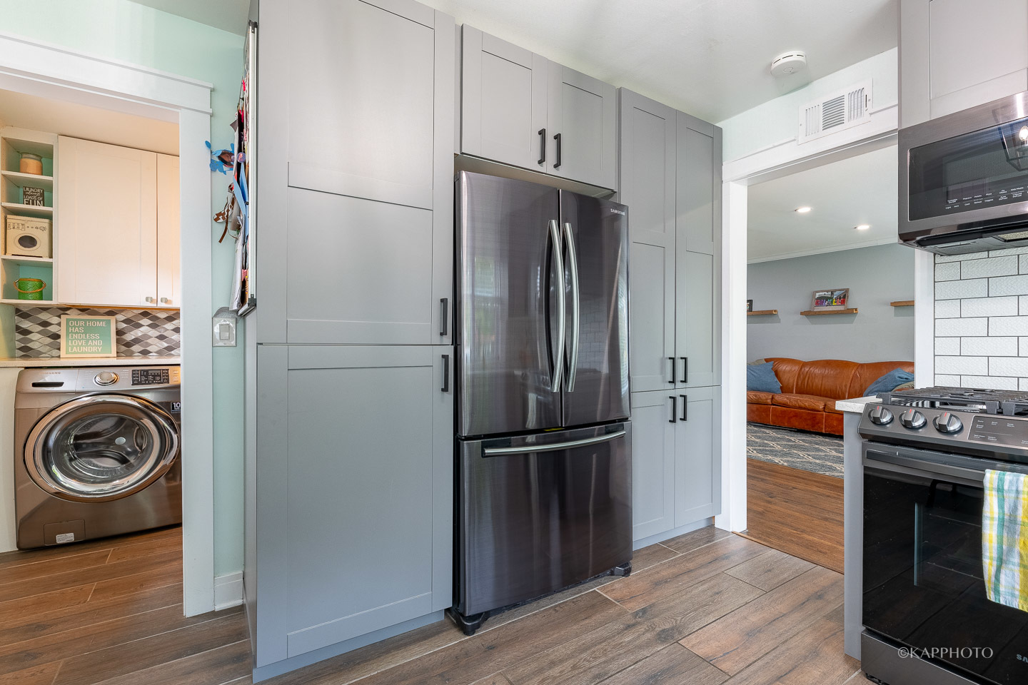 2124 Seward Street Evanston, IL 60202 - Photo 13 of 27 a kitchen with a refrigerator and a stove top oven