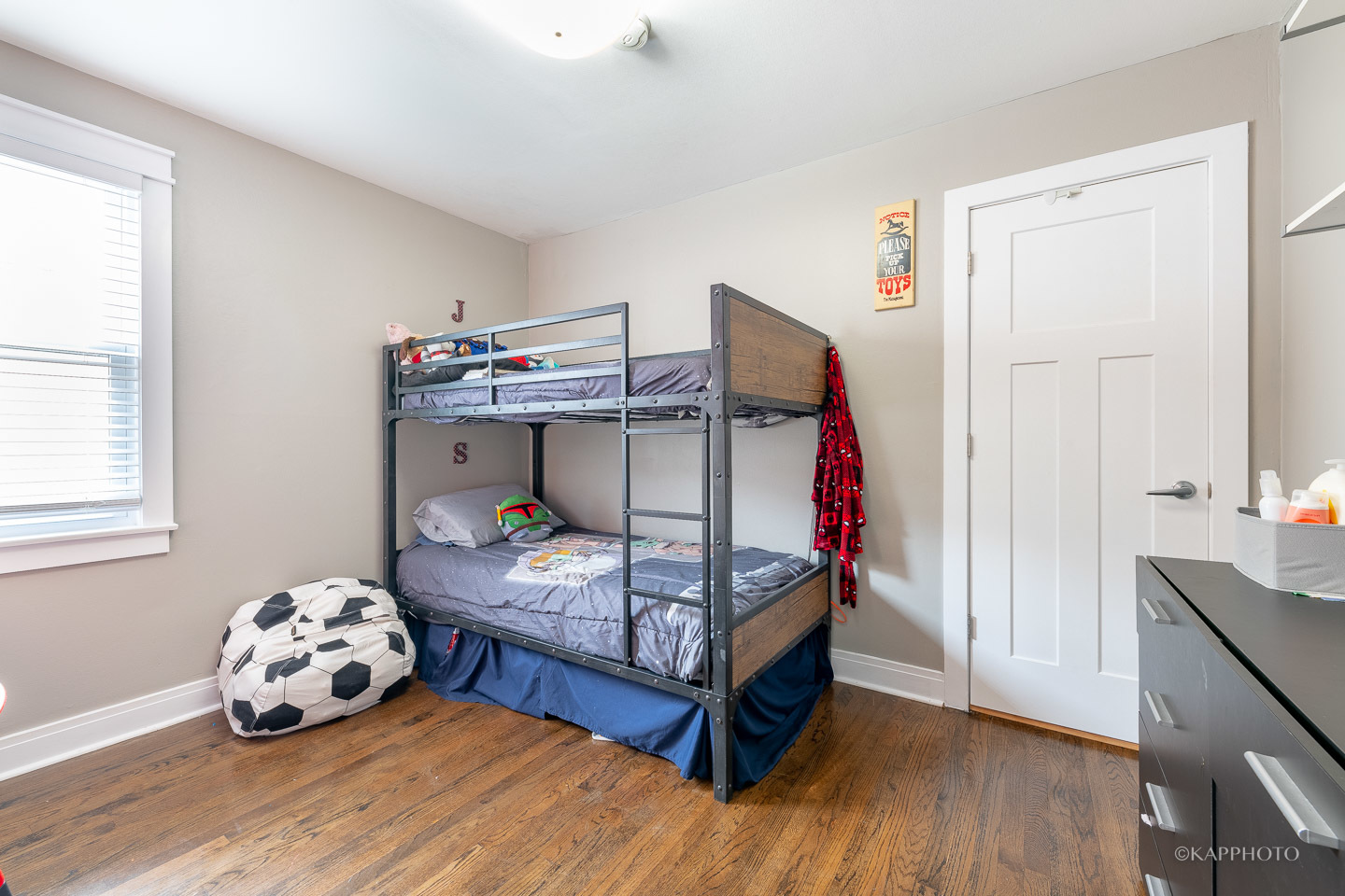 2124 Seward Street Evanston, IL 60202 - Photo 19 of 27 a bedroom with a bed and wooden floor