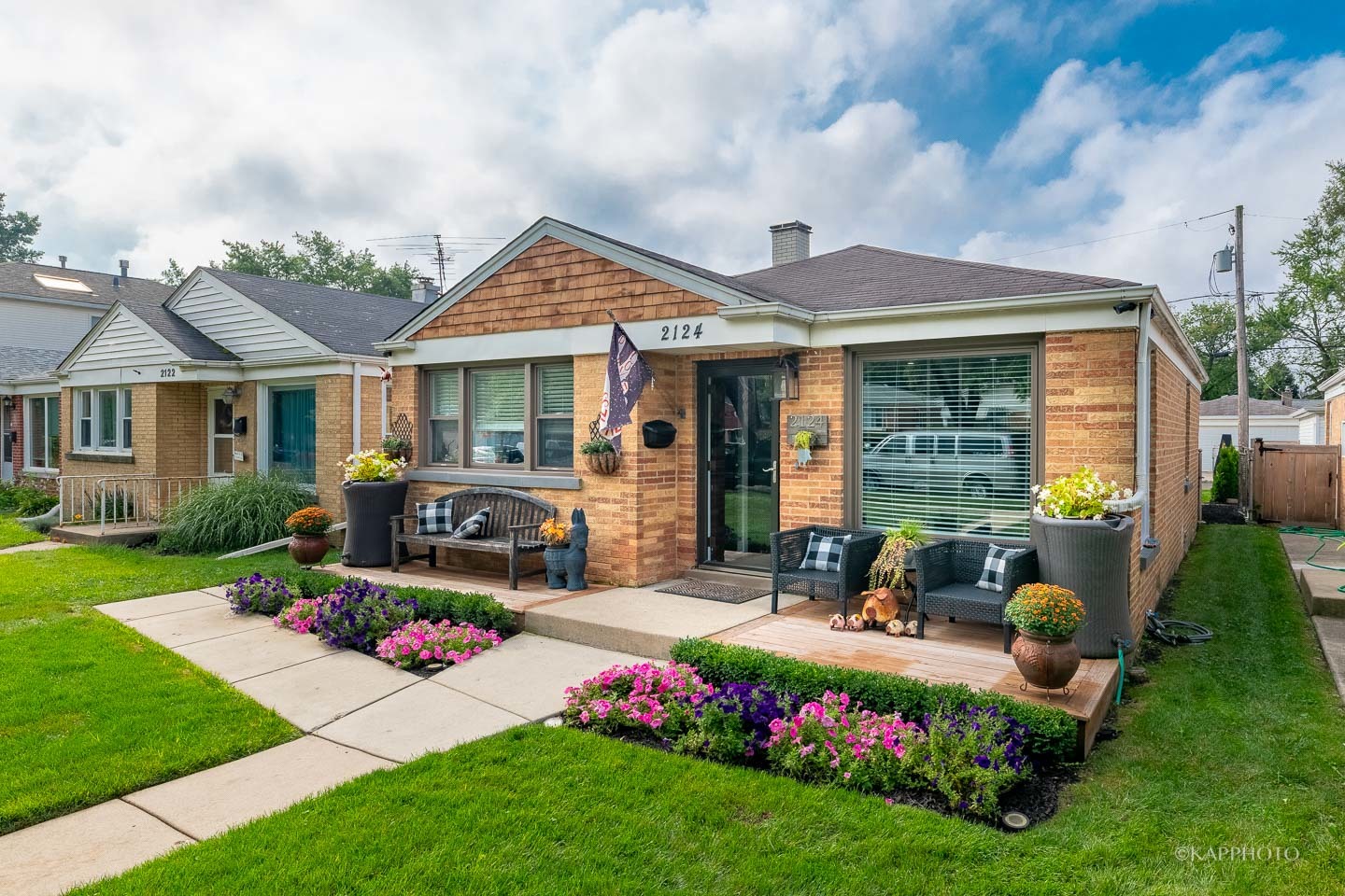2124 Seward Street Evanston, IL 60202 - Photo 2 of 27 a front view of a house with garden