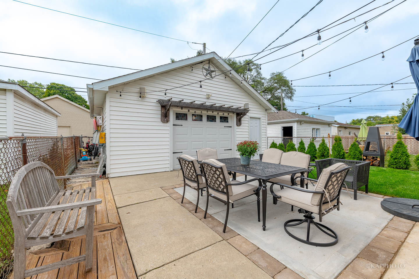 2124 Seward Street Evanston, IL 60202 - Photo 23 of 27 a view of a patio with table and chairs with wooden floor and fence