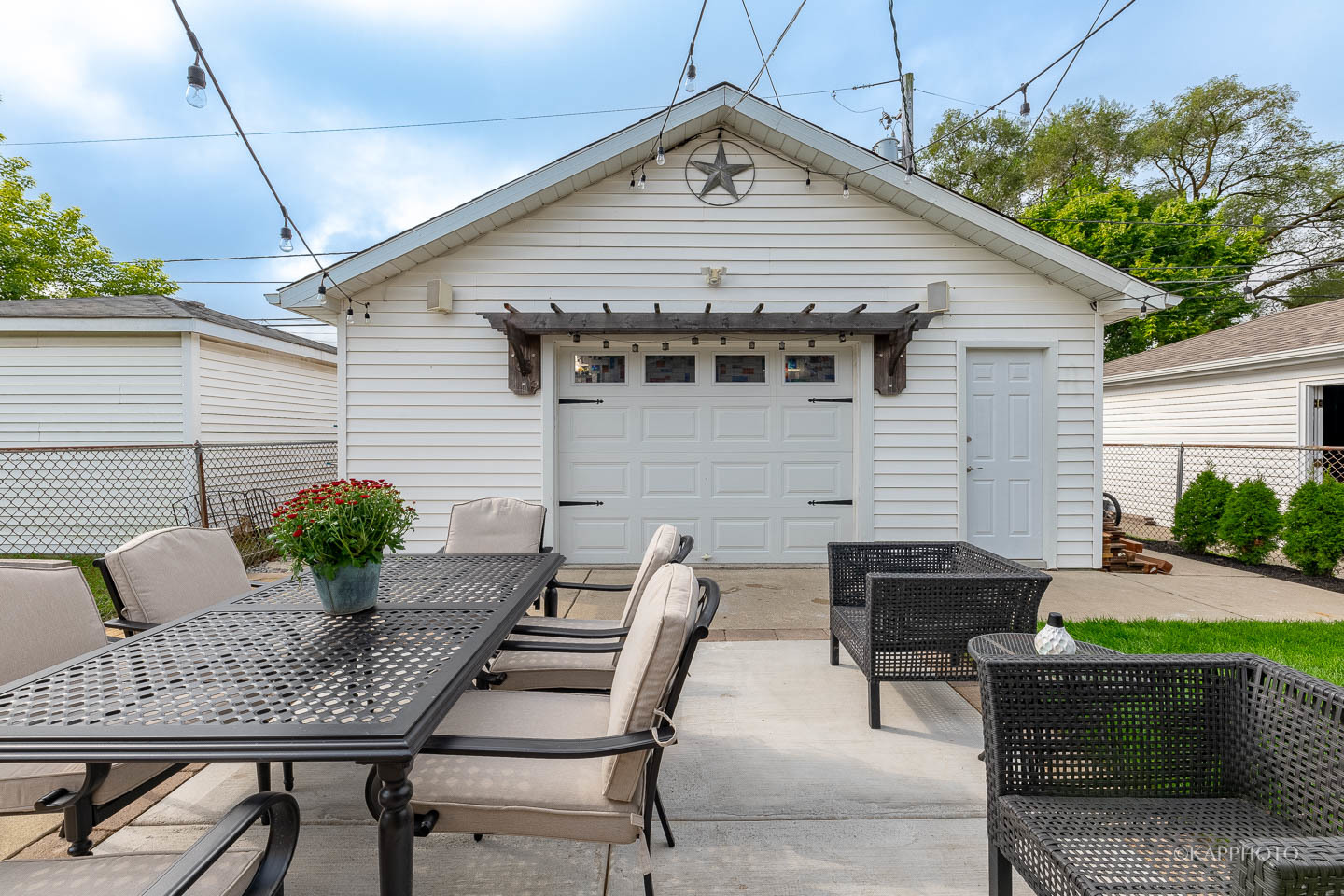 2124 Seward Street Evanston, IL 60202 - Photo 27 of 27 a view of a patio with a table and chairs and potted plants