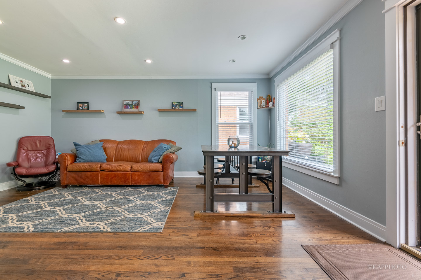 2124 Seward Street Evanston, IL 60202 - Photo 6 of 27 a living room with furniture a wooden floor and a window
