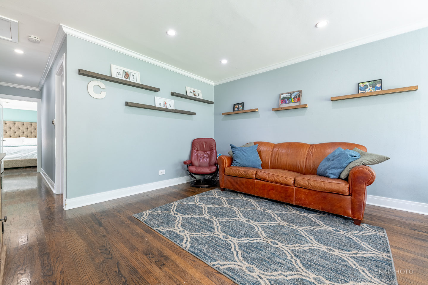 2124 Seward Street Evanston, IL 60202 - Photo 7 of 27 a living room with furniture and a wooden floor