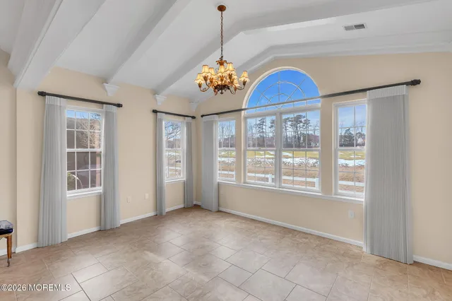 a kitchen with stainless steel appliances granite countertop a refrigerator microwave and stove