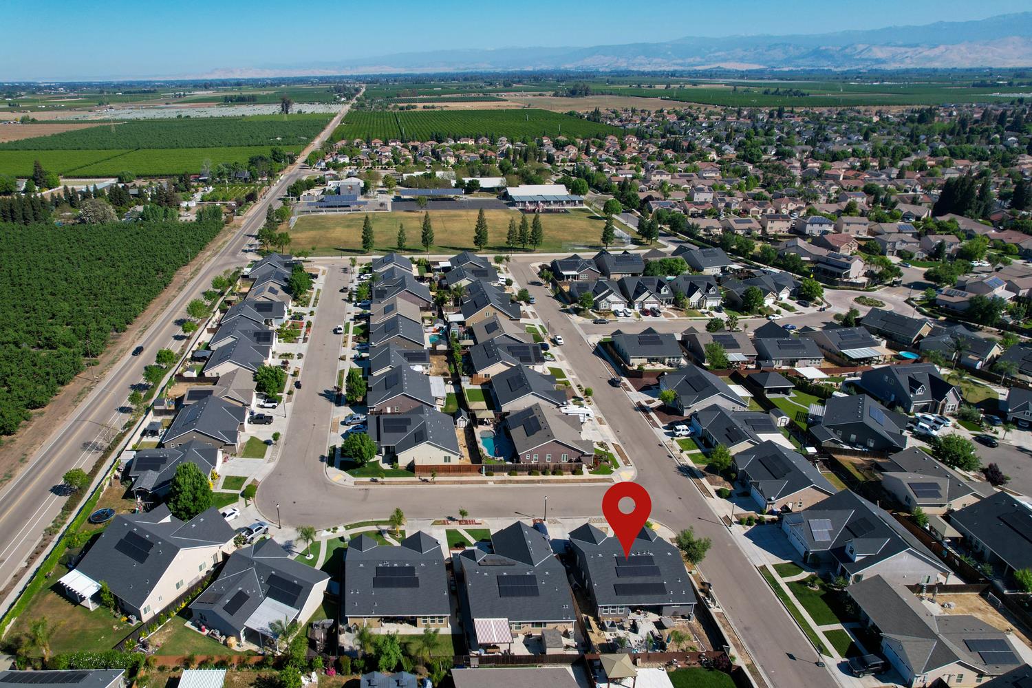 3133 4th Street Sanger, CA 93657 - Photo 28 of 33 an aerial view of residential building and lake