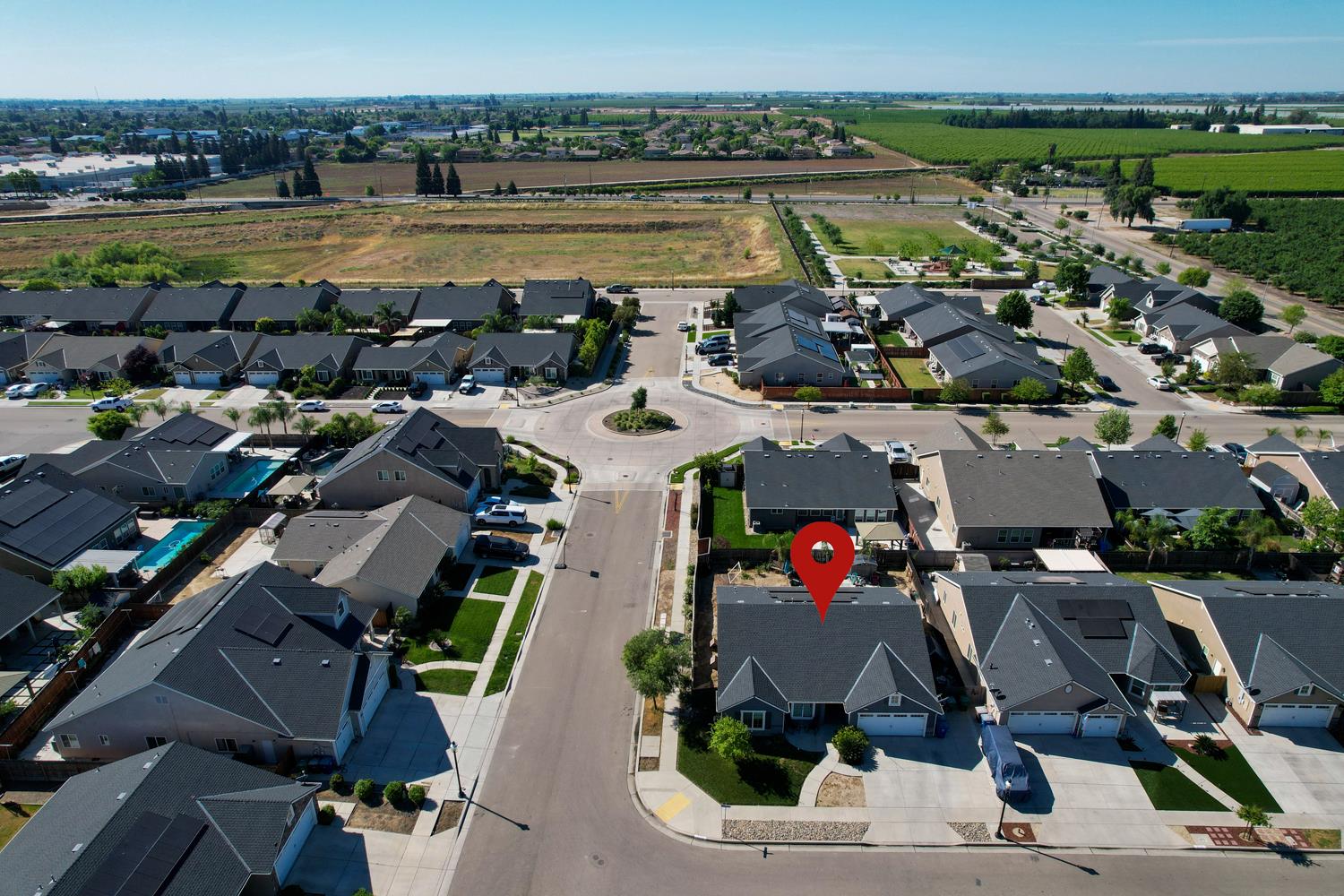 3133 4th Street Sanger, CA 93657 - Photo 30 of 33 an aerial view of a building with outdoor space