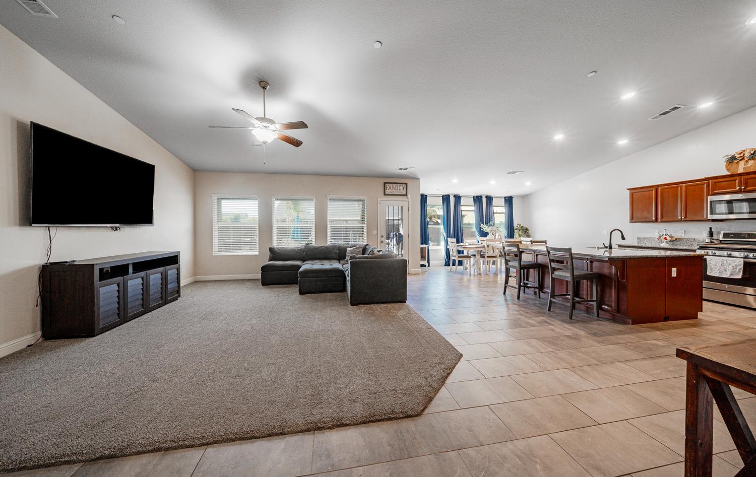 3133 4th Street Sanger, CA 93657 - Photo 6 of 33 a living room with furniture and a flat screen tv