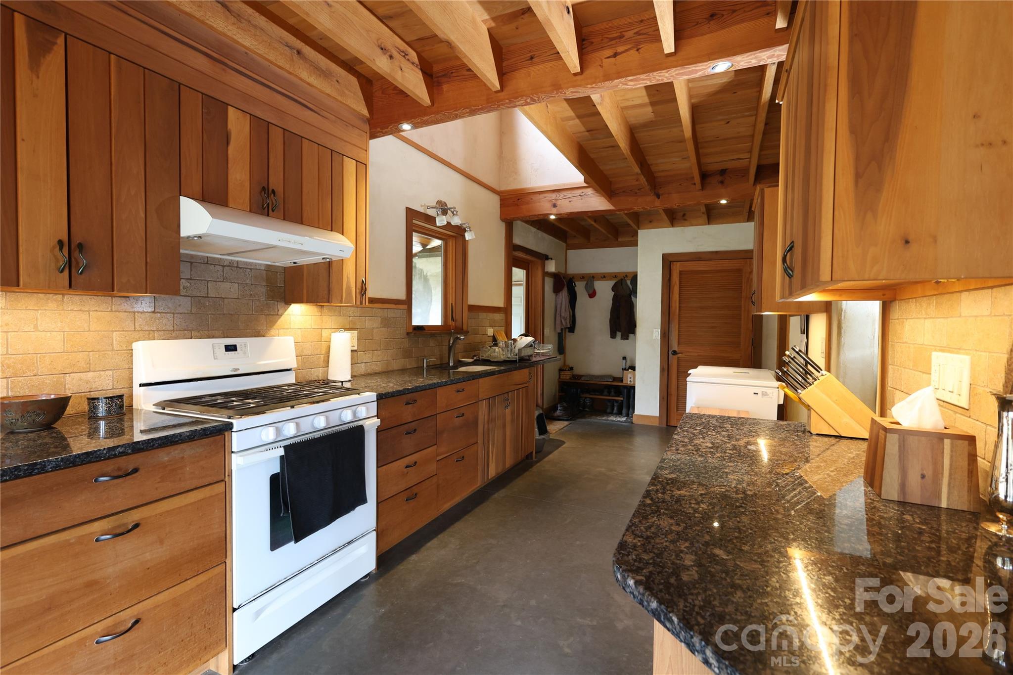 1422 Middle Fork Road Hendersonville, NC 28792 - Photo 12 of 48 a kitchen with stainless steel appliances granite countertop a stove a sink and a refrigerator