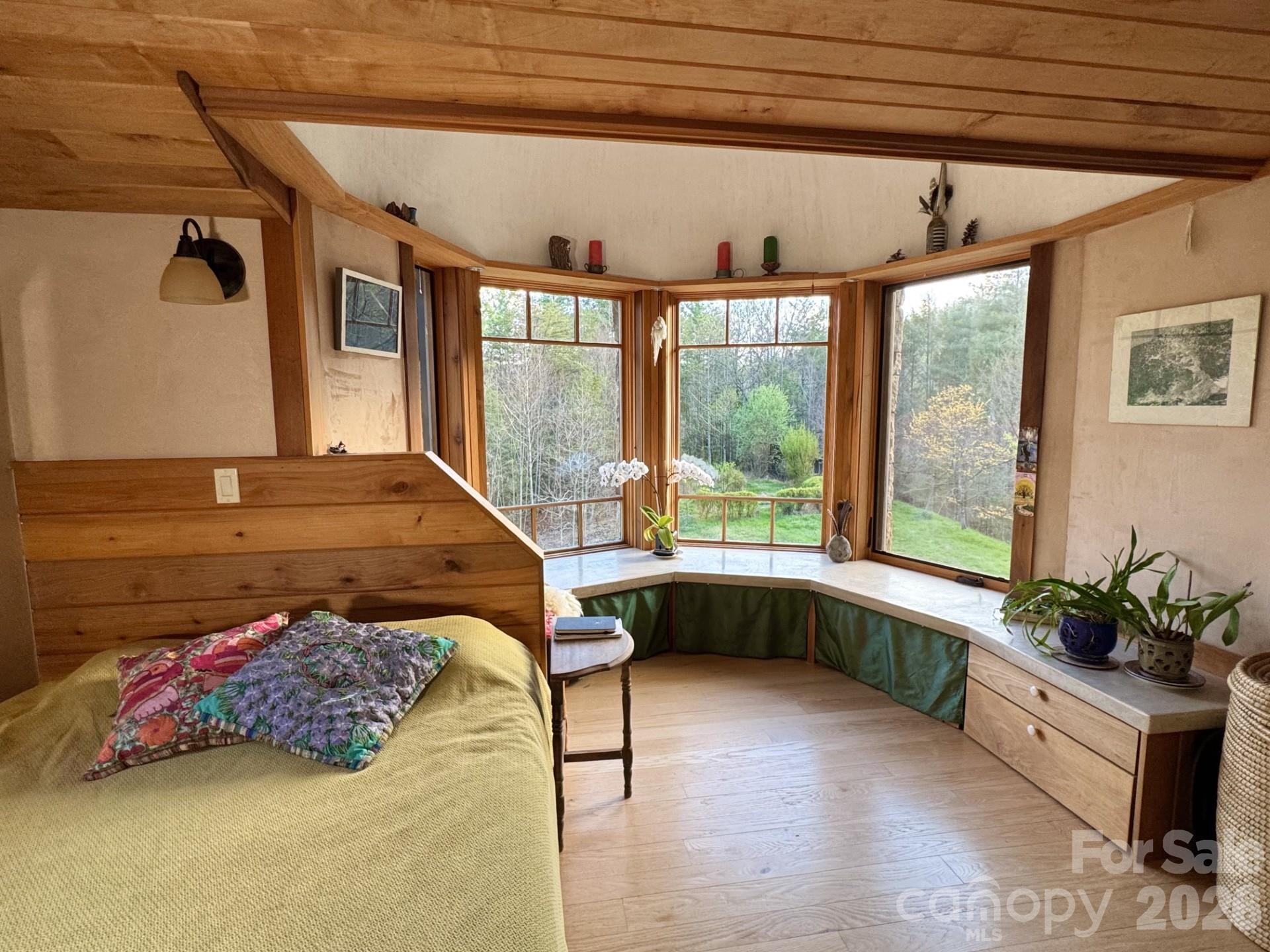 1422 Middle Fork Road Hendersonville, NC 28792 - Photo 26 of 48 a bedroom with a bed and a large window