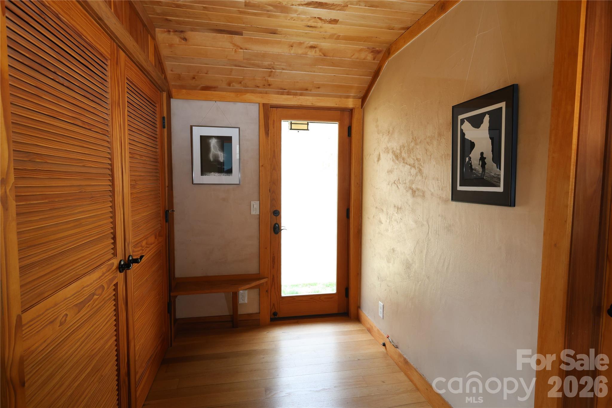 1422 Middle Fork Road Hendersonville, NC 28792 - Photo 32 of 48 a view of a hallway with wooden floor and a bathroom