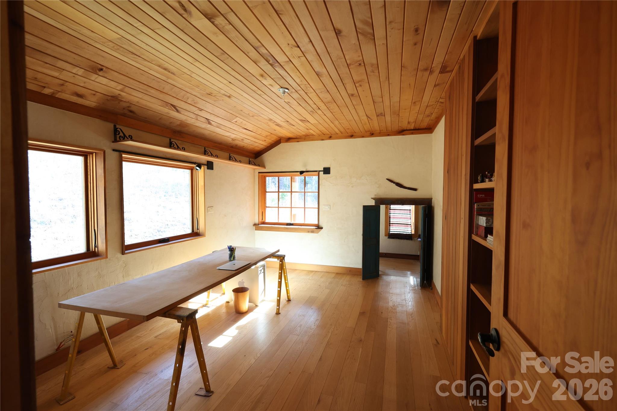 1422 Middle Fork Road Hendersonville, NC 28792 - Photo 33 of 48 a view of an empty room with wooden floor and a window