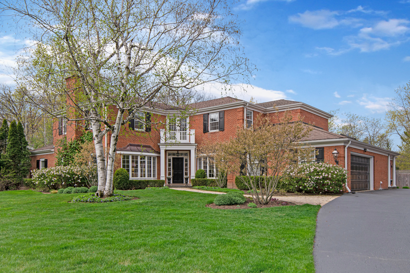 500 Douglas Drive Lake Forest, IL 60045 - Photo 1 of 34 a front view of a house with a garden