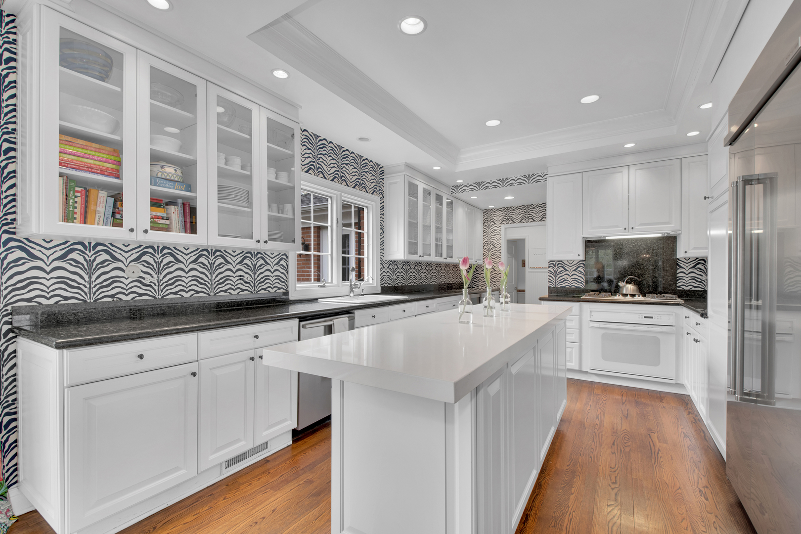 500 Douglas Drive Lake Forest, IL 60045 - Photo 11 of 34 a kitchen with white cabinets and sink
