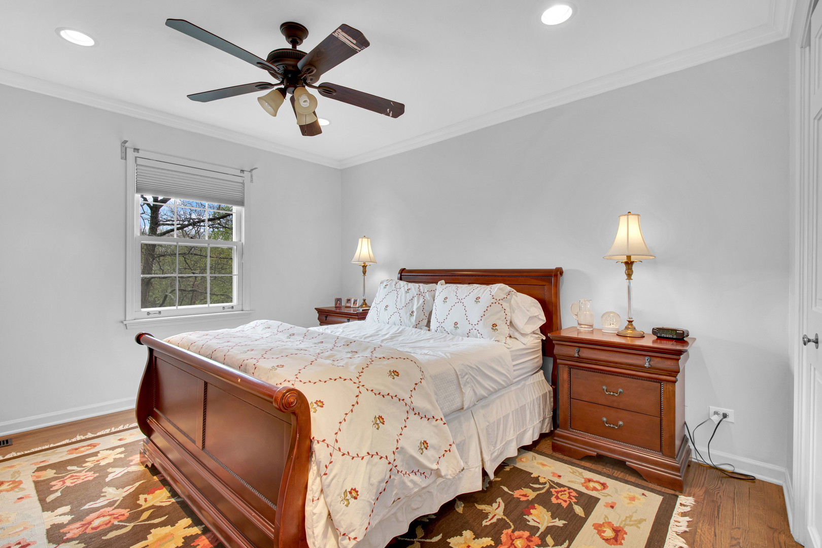 500 Douglas Drive Lake Forest, IL 60045 - Photo 25 of 34 a bedroom with a bed and a chandelier