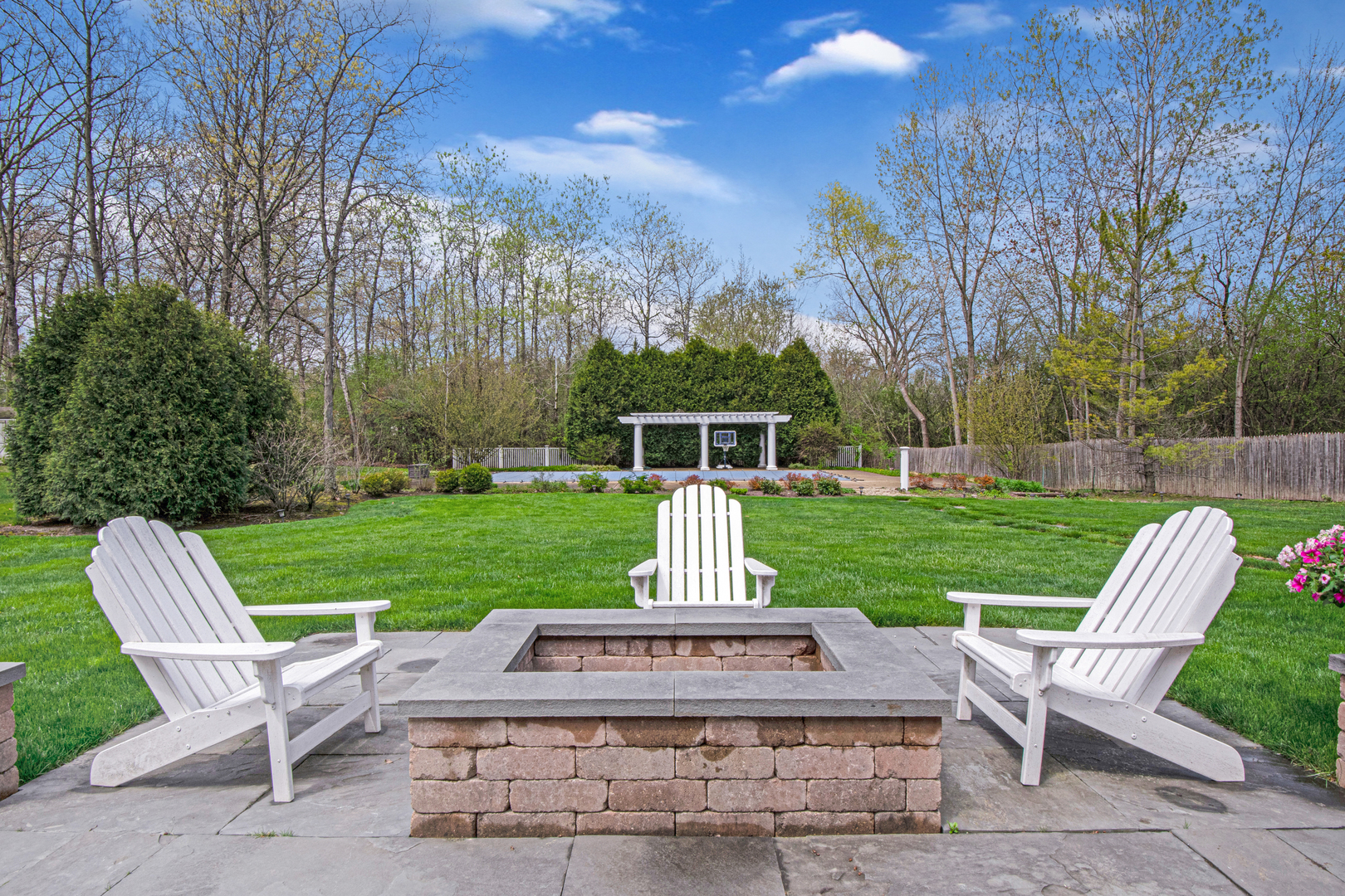 500 Douglas Drive Lake Forest, IL 60045 - Photo 30 of 34 a view of a table and chairs in the garden and grass