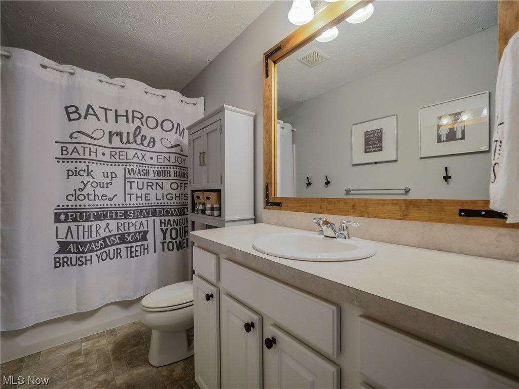 37571 Amber Way North Ridgeville, OH 44039 - Photo 24 of 35 Bathroom featuring tile flooring, vanity with extensive cabinet space, and toilet