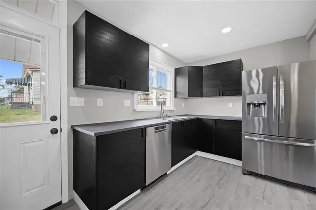 a kitchen with a refrigerator stove and microwave