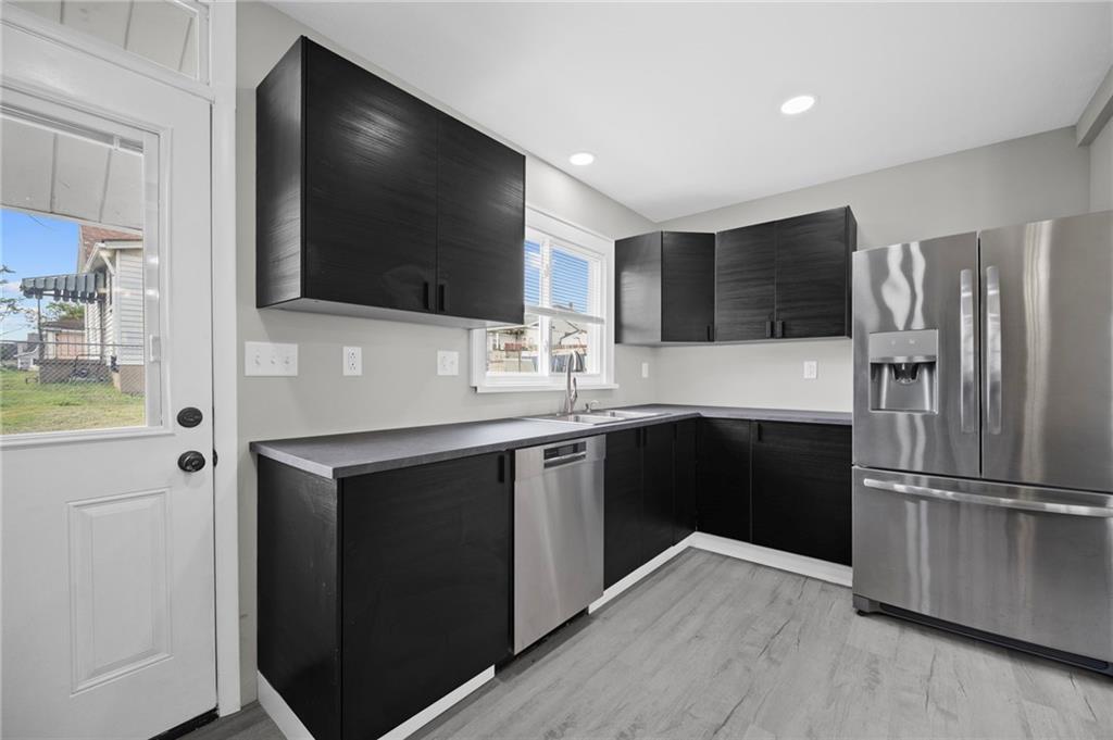 423 2nd Street Donora, PA 15033 - Photo 17 of 47 a kitchen with a refrigerator stove and microwave