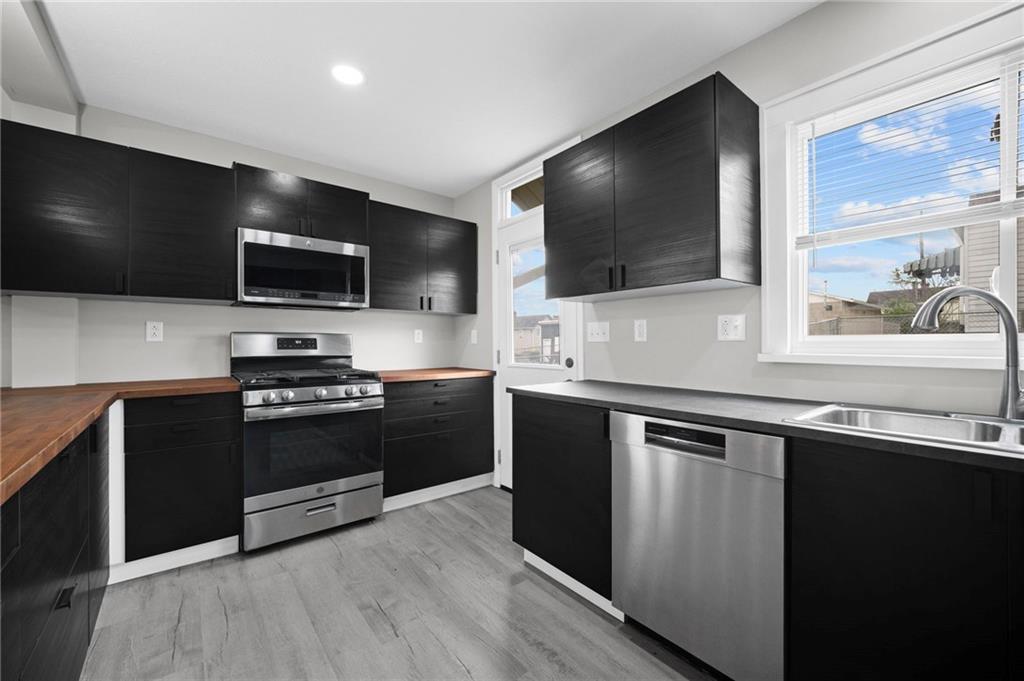 423 2nd Street Donora, PA 15033 - Photo 19 of 47 a kitchen with stainless steel appliances and view of living room