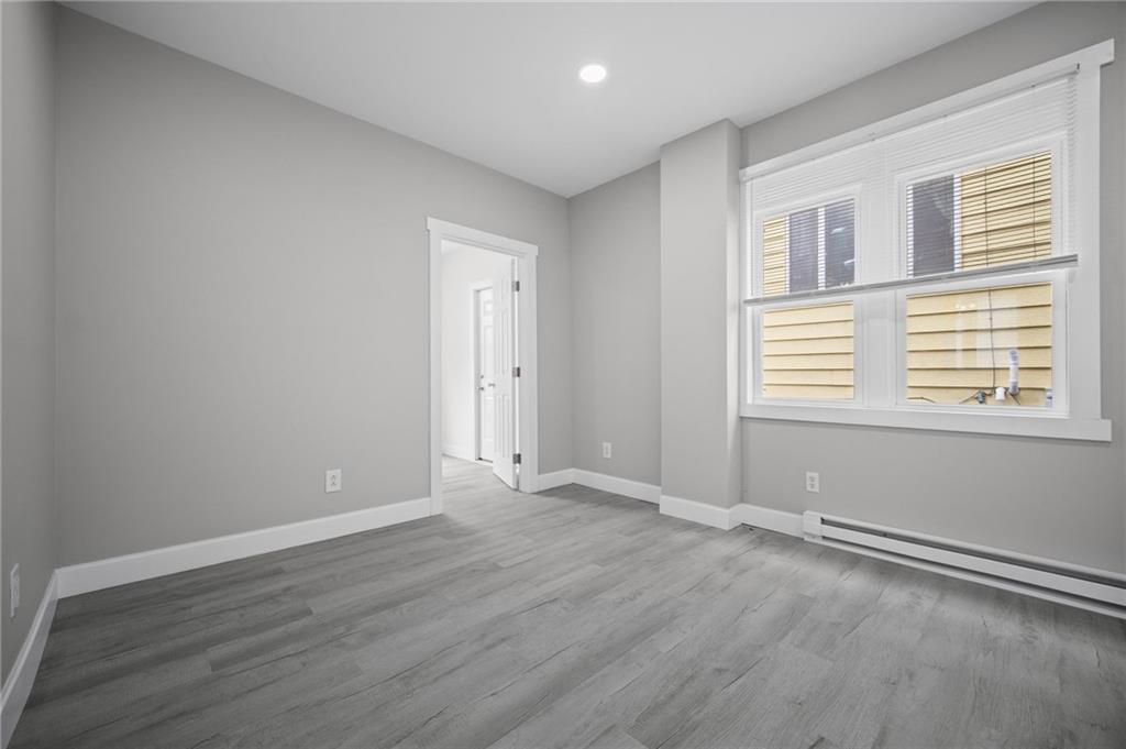 423 2nd Street Donora, PA 15033 - Photo 22 of 47 a view of an empty room with wooden floor and a window