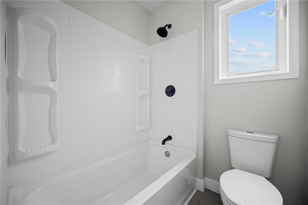 423 2nd Street Donora, PA 15033 - Photo 26 of 47 a white toilet sitting next to a bath tub