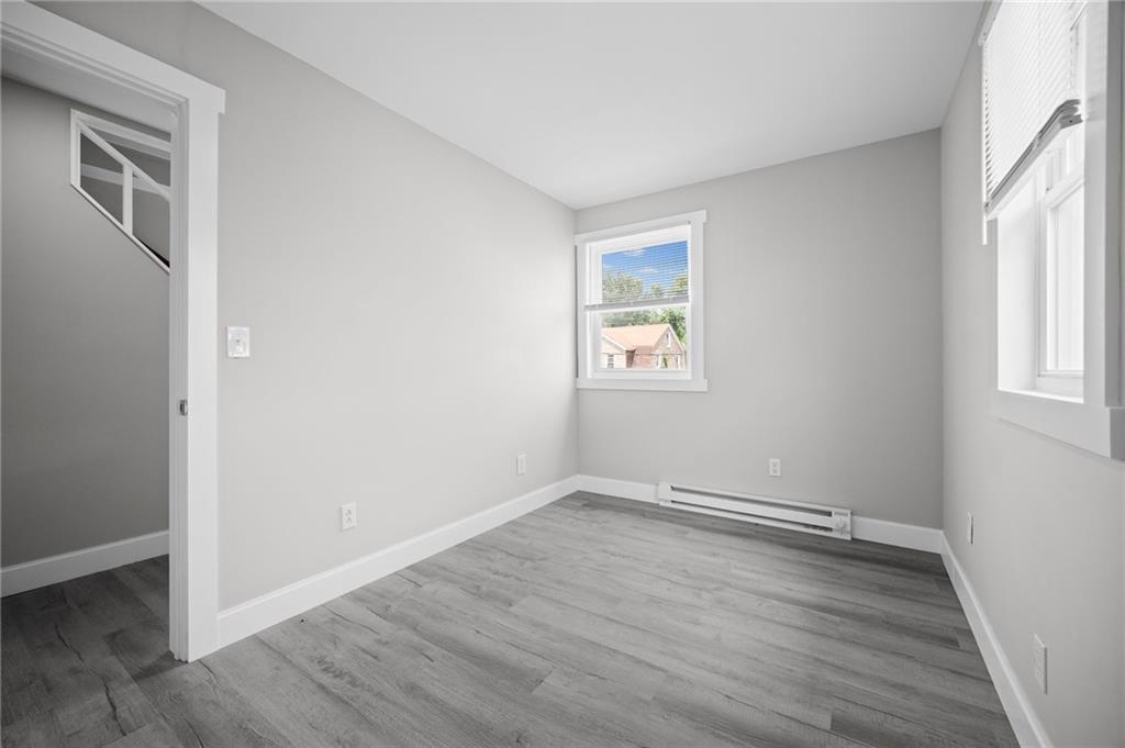423 2nd Street Donora, PA 15033 - Photo 29 of 47 an empty room with wooden floor and windows