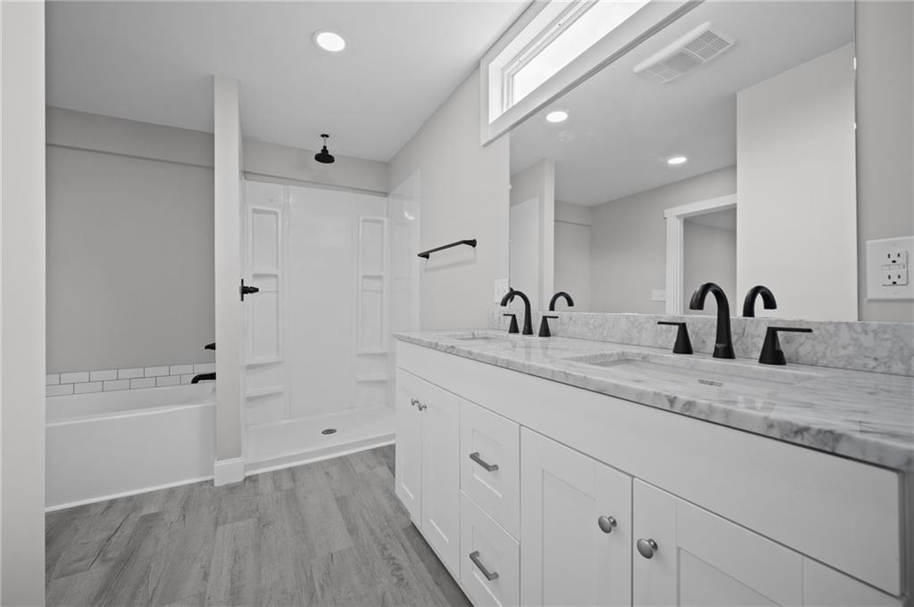 423 2nd Street Donora, PA 15033 - Photo 35 of 47 a spacious bathroom with a tub sink and mirror