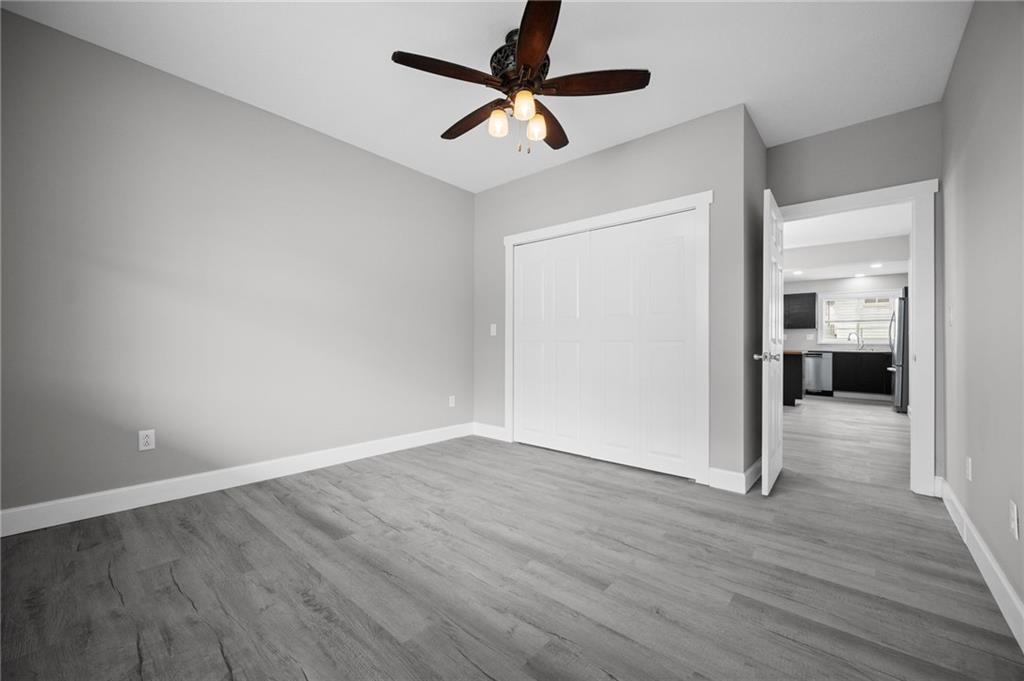 423 2nd Street Donora, PA 15033 - Photo 9 of 47 a view of an empty room with a window and wooden floor