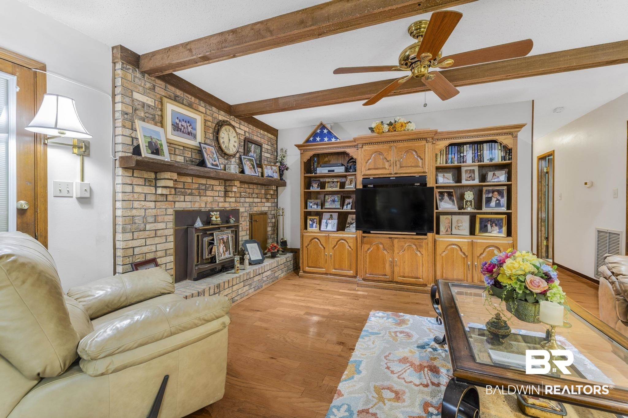 10207 Plantation Drive Daphne, AL 36526 - Photo 34 of 48 Living area featuring light wood-style flooring, ceiling fan, and beam ceiling