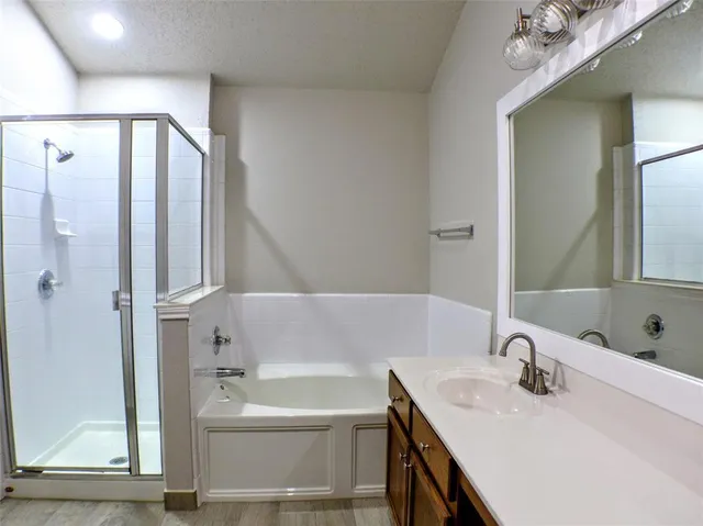 a bathroom with a bathtub and a sink