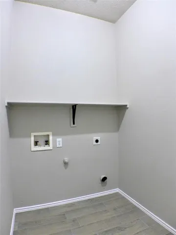 an empty room with a wooden floor