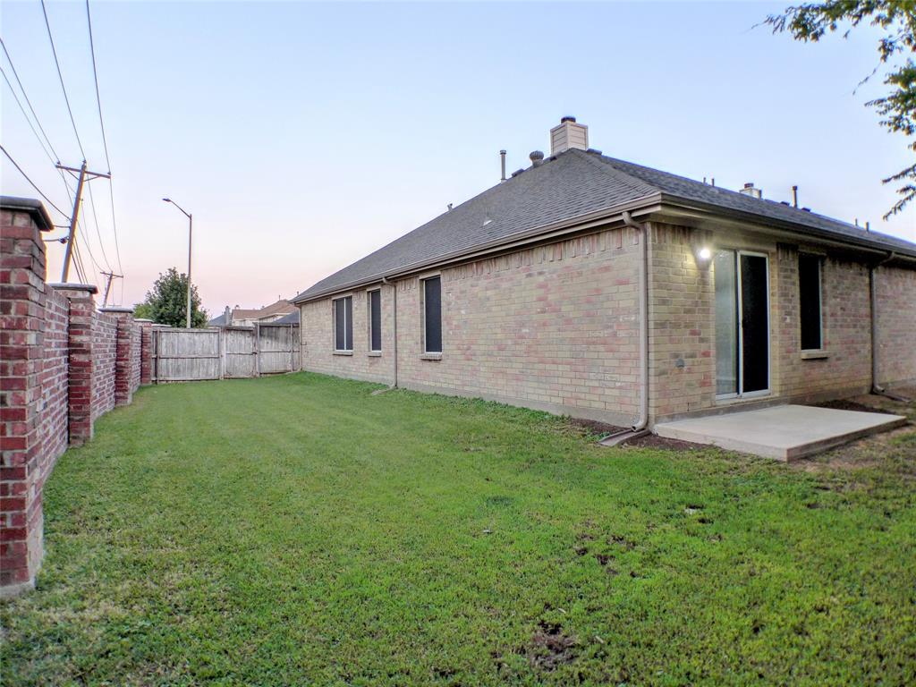 7300 Cresswell Drive Arlington, TX 76001 - Photo 18 of 20 a view of a backyard with potted plants