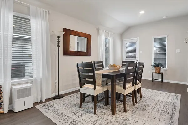 a view of a dining room with furniture