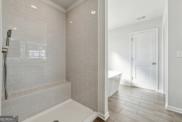a bathroom with a bathtub and toilet