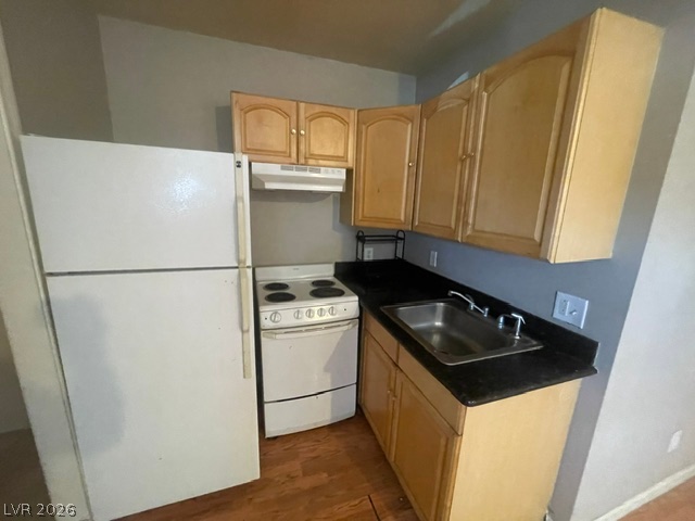 Functional kitchen with ample cabinet space and full-size appliances for everyday living.