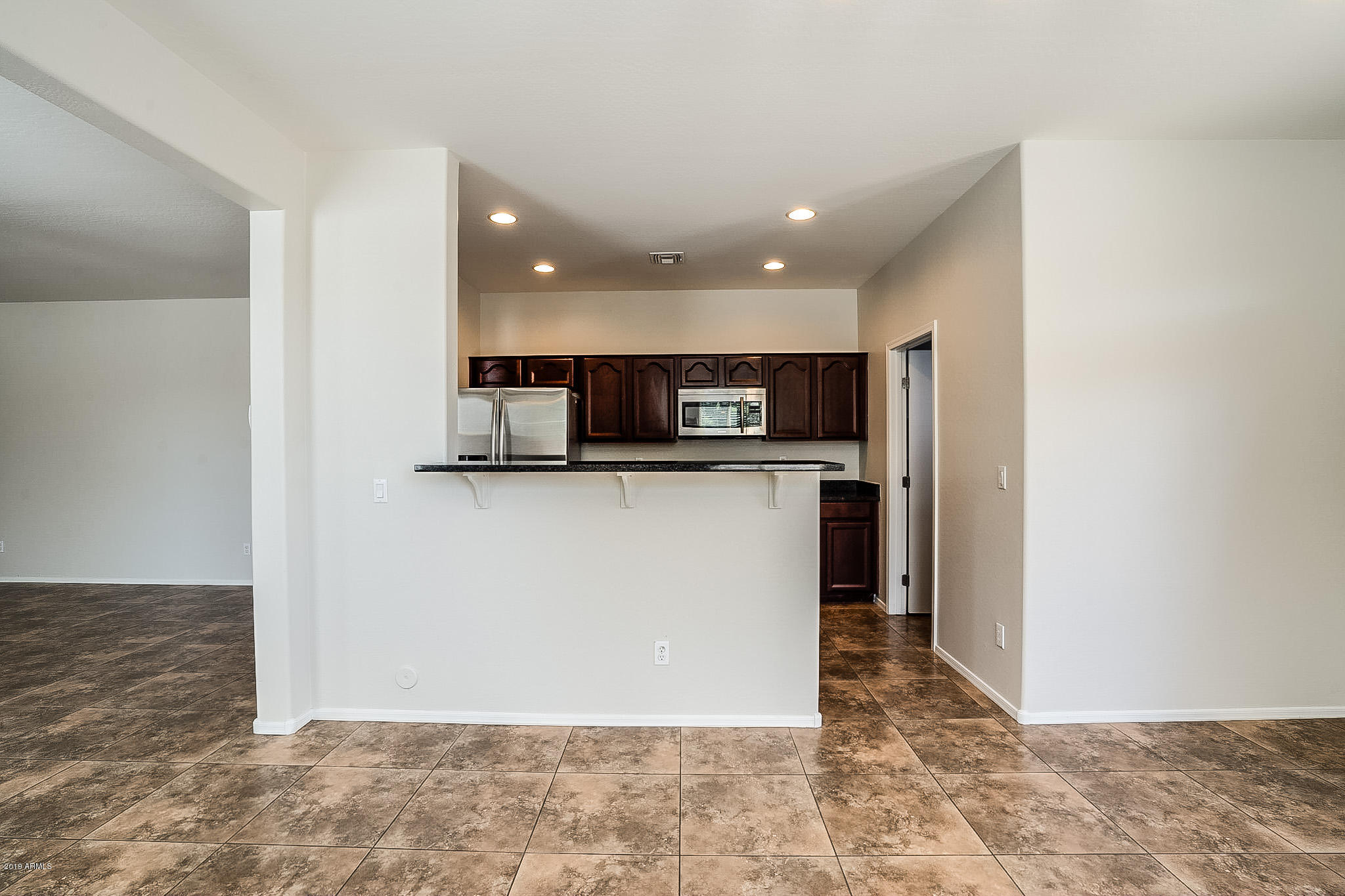 7425 West Darrel Road Laveen, AZ 85339 - Photo 23 of 64 a view of kitchen with stainless steel appliances granite countertop a refrigerator and a sink