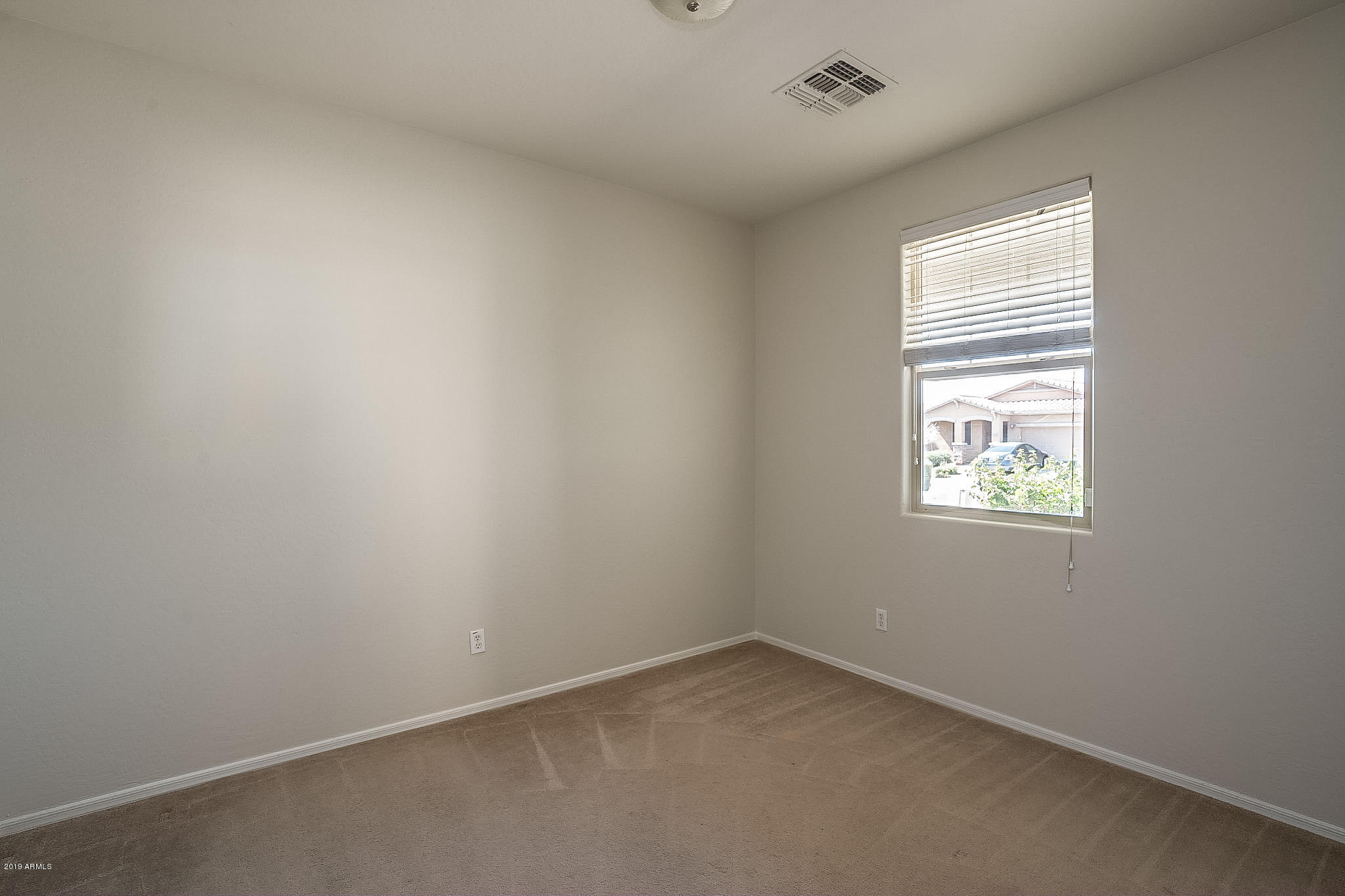 7425 West Darrel Road Laveen, AZ 85339 - Photo 32 of 64 an empty room with a window