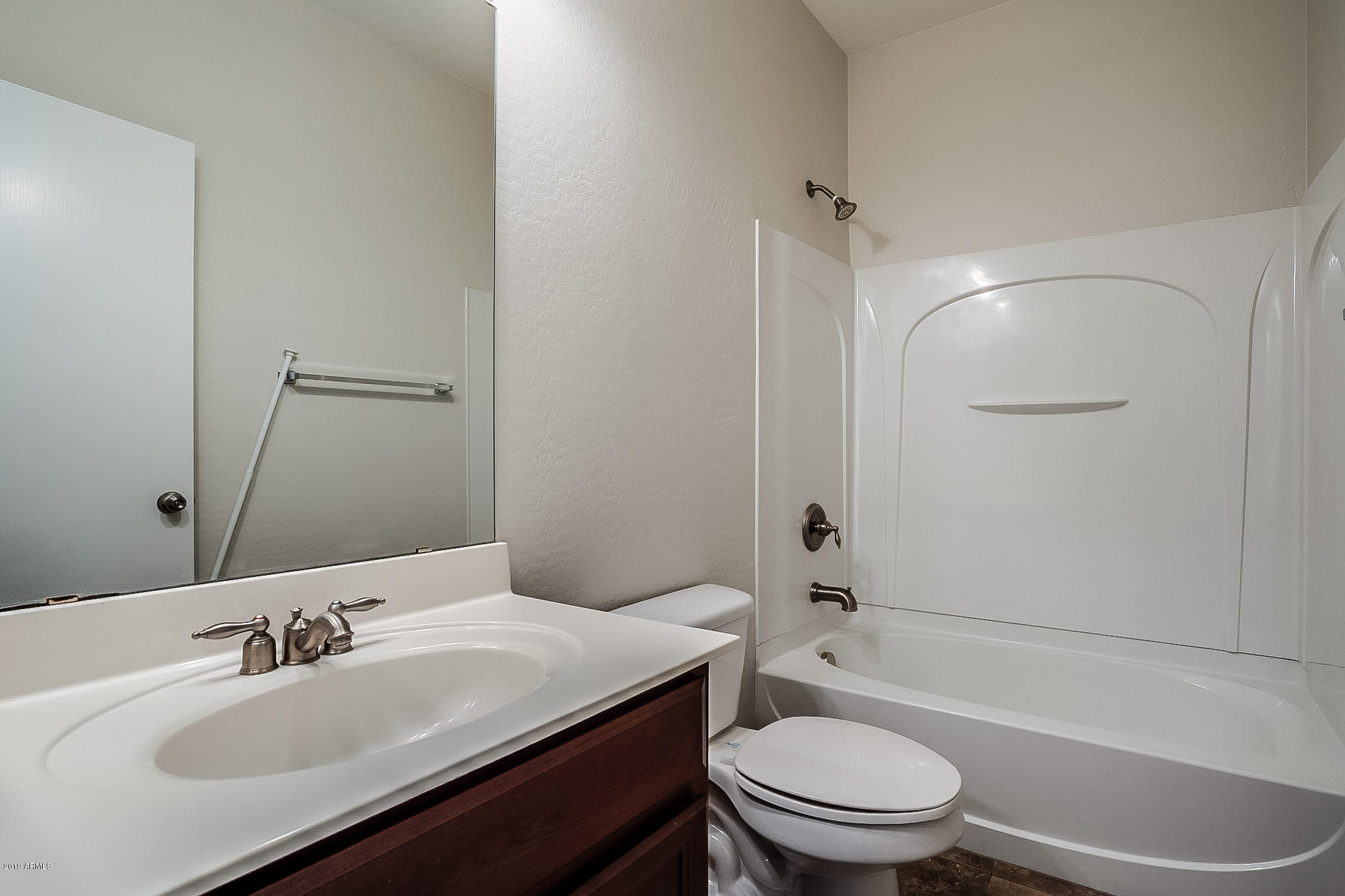 7425 West Darrel Road Laveen, AZ 85339 - Photo 36 of 64 a bathroom with a sink toilet vanity and shower