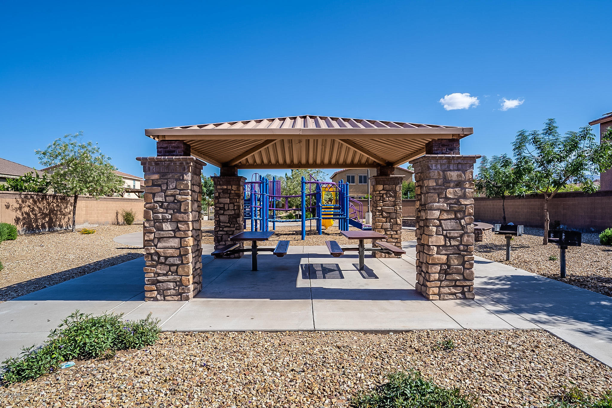 7425 West Darrel Road Laveen, AZ 85339 - Photo 45 of 64 a view of a chairs and table under an umbrella in patio