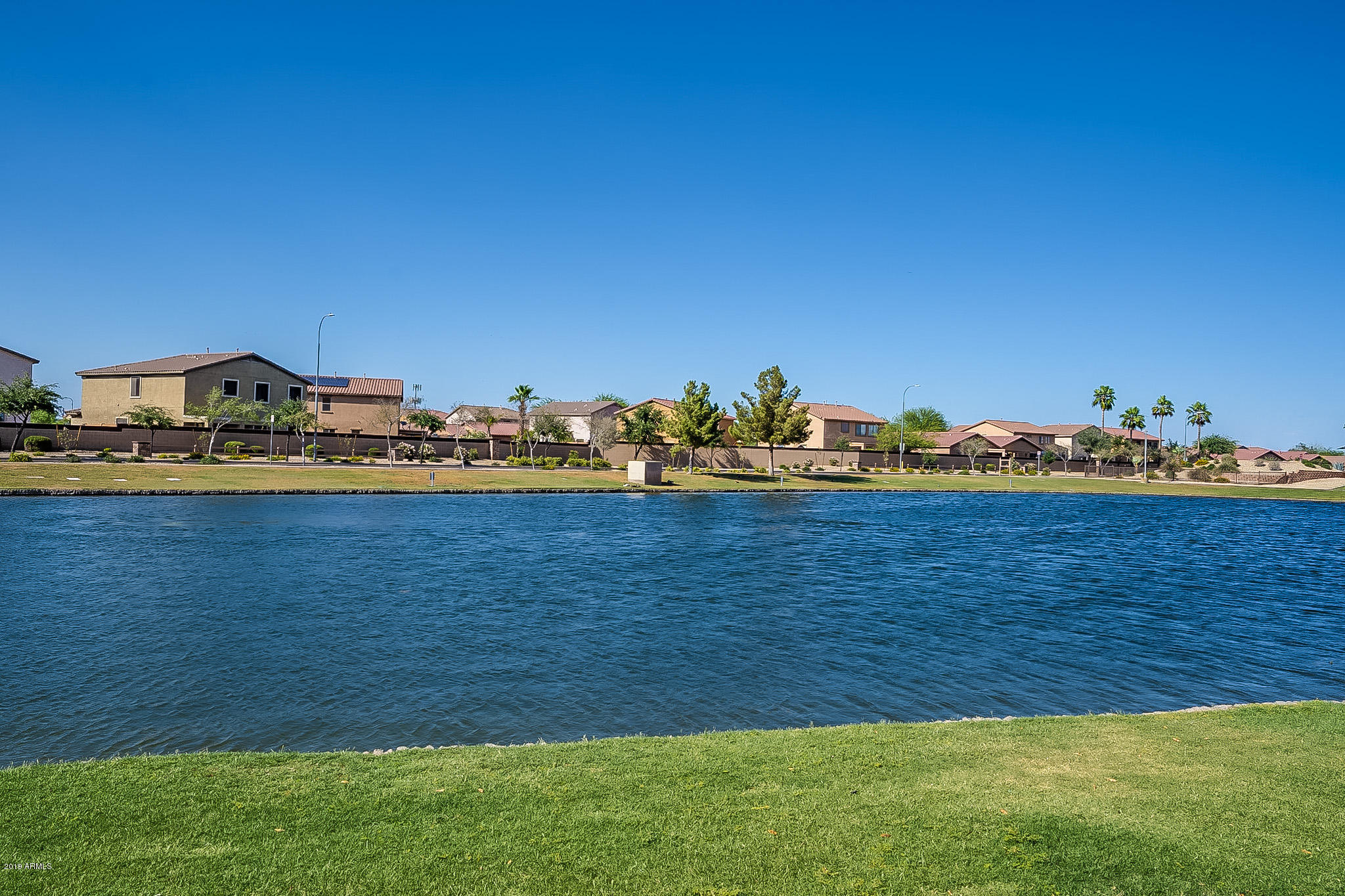 7425 West Darrel Road Laveen, AZ 85339 - Photo 56 of 64 a view of a lake with houses