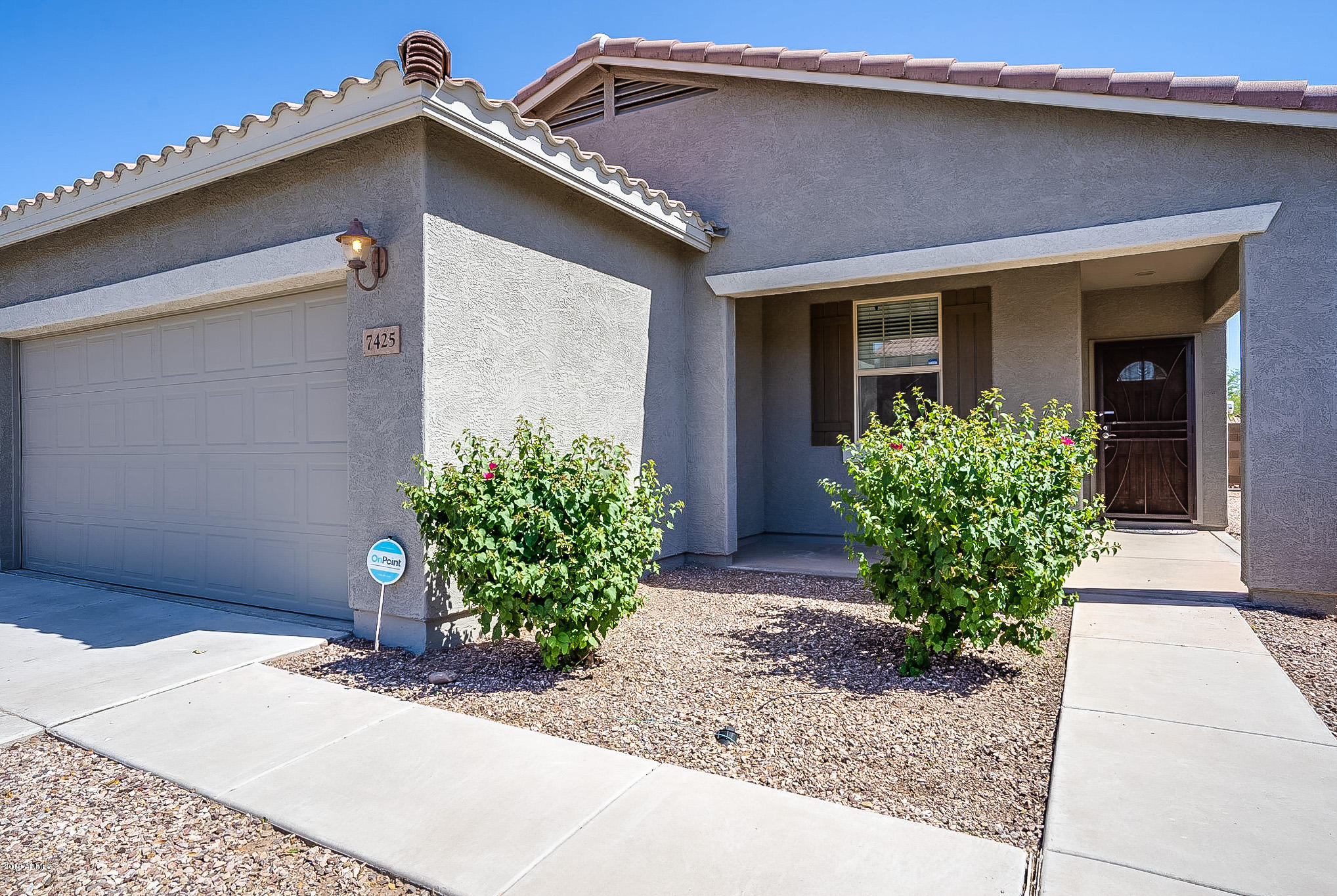 7425 West Darrel Road Laveen, AZ 85339 - Photo 62 of 64 a front view of a house with garden