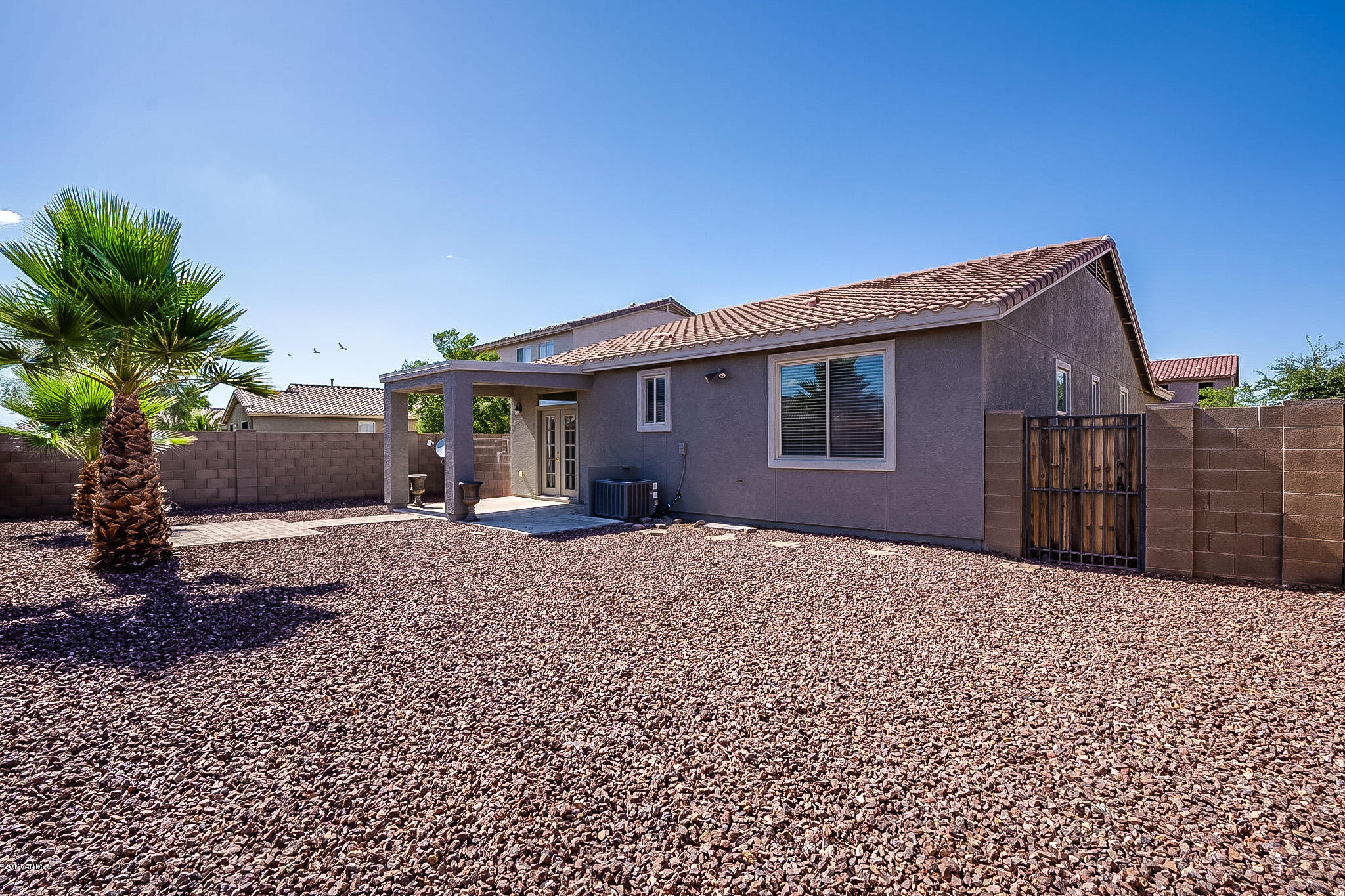 7425 West Darrel Road Laveen, AZ 85339 - Photo 64 of 64 a front view of a house with a garden