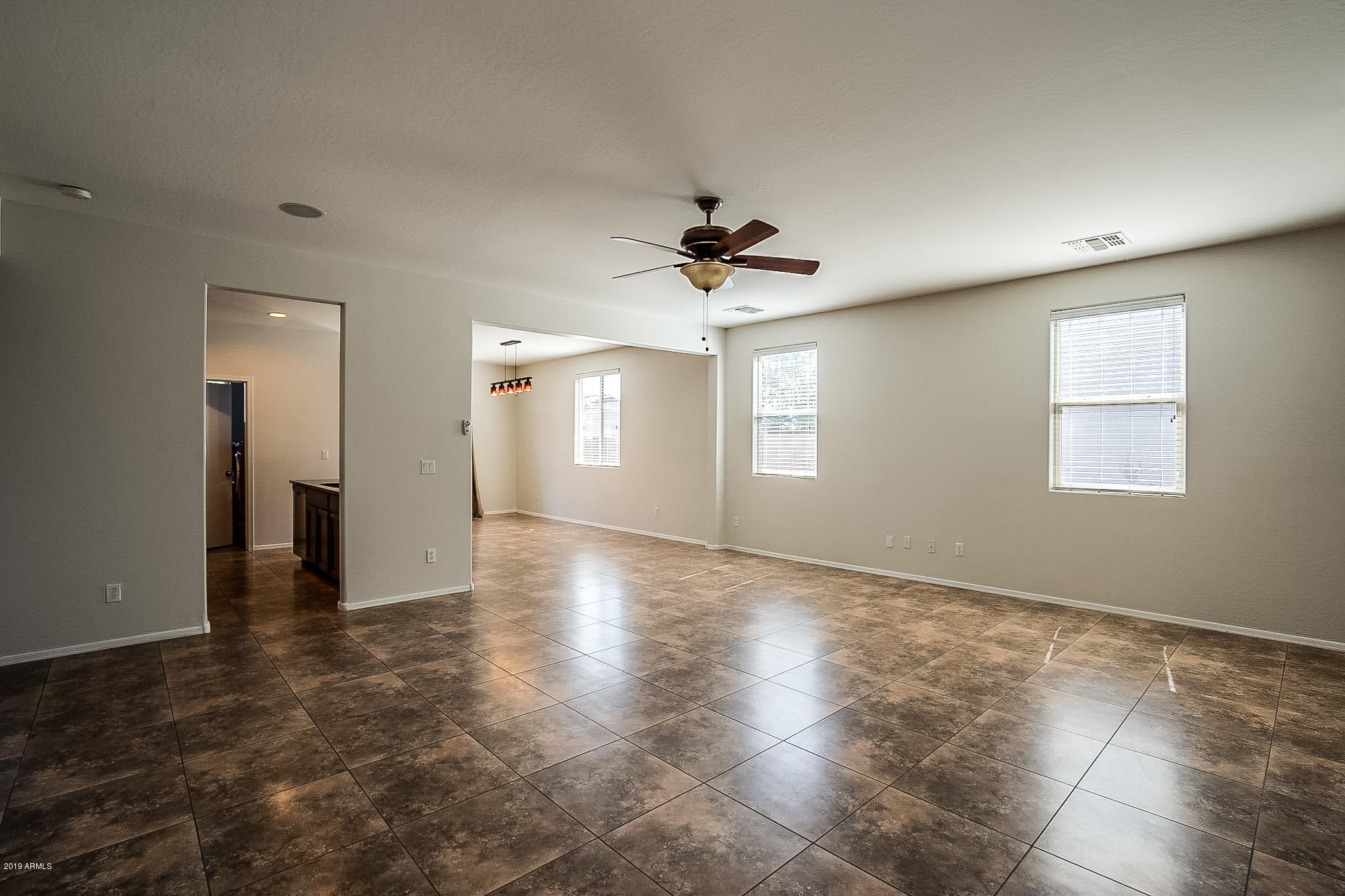 7425 West Darrel Road Laveen, AZ 85339 - Photo 9 of 64 a view of an empty room with a window